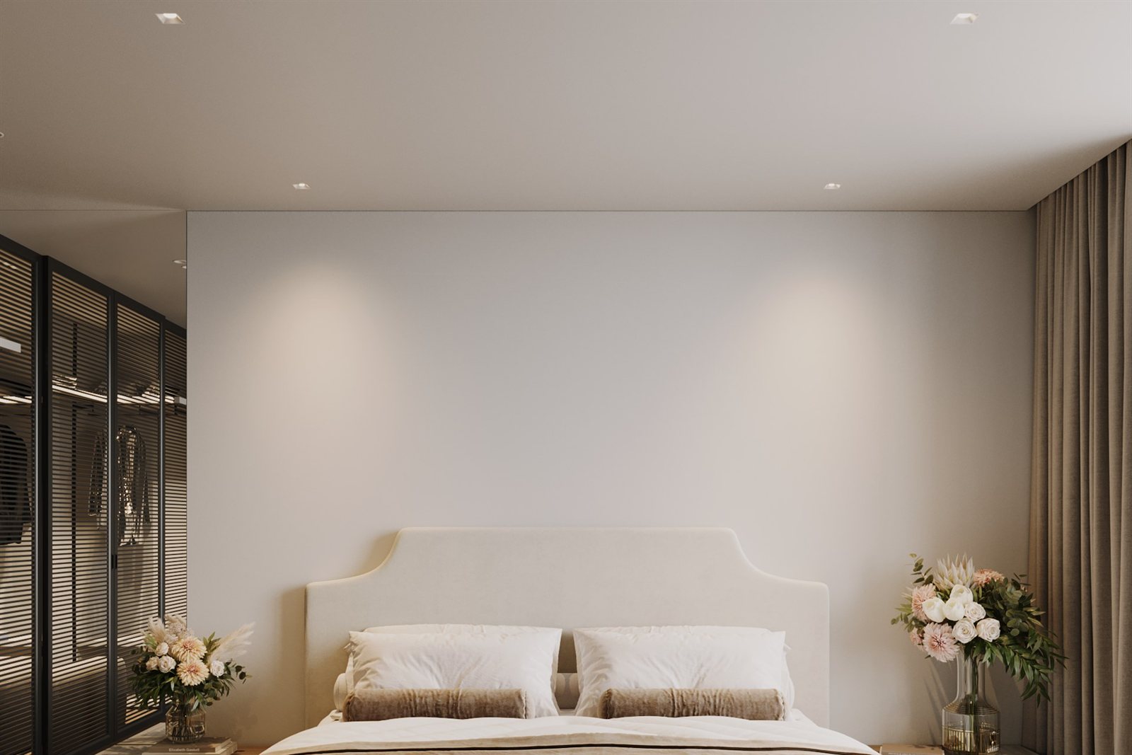 A calm, neutral bedroom lit by recessed Libra downlights washing the walls in soft warm light